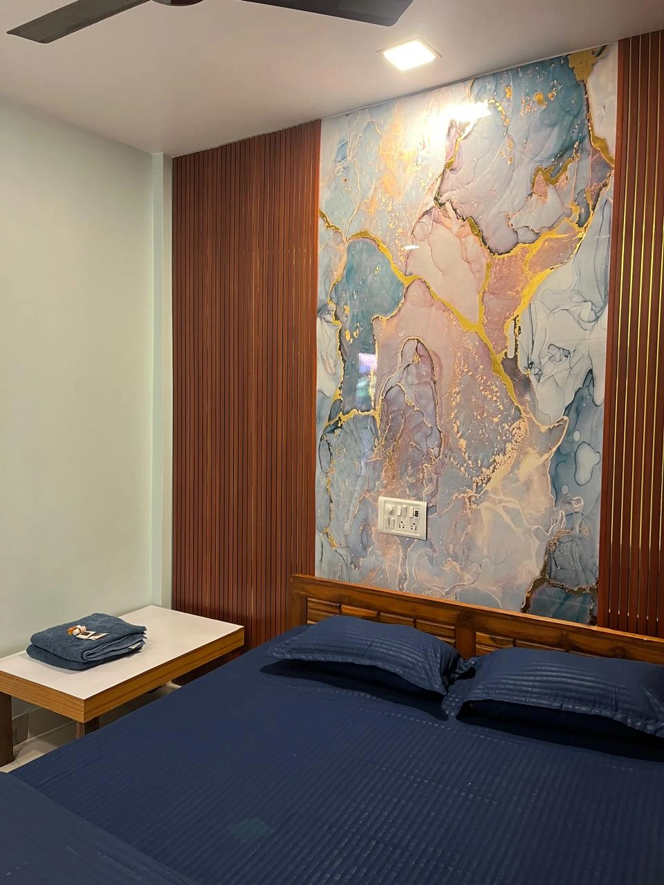 Comfortable room at Dolphin House Beach Resort used on a page about weekend stays in Alibaug